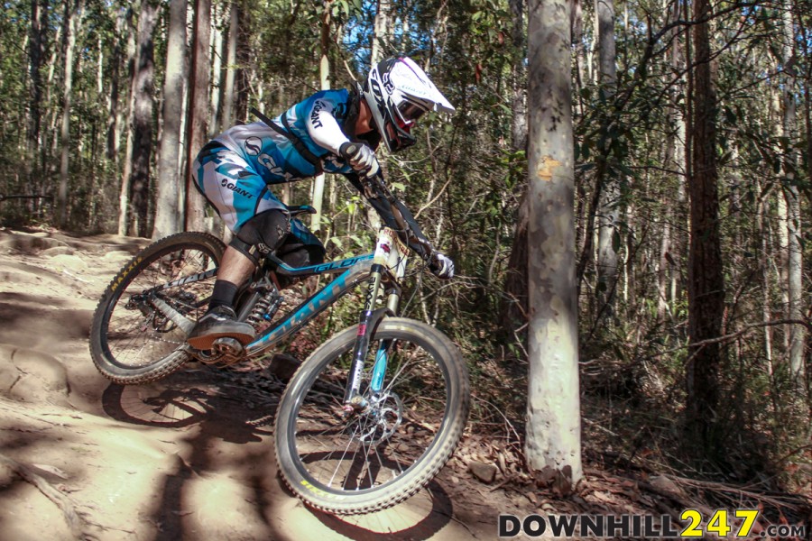 Andrew Crimmins (1) soaring through the lower rock garden, and looking fast through a section that had riders divided for line choice.