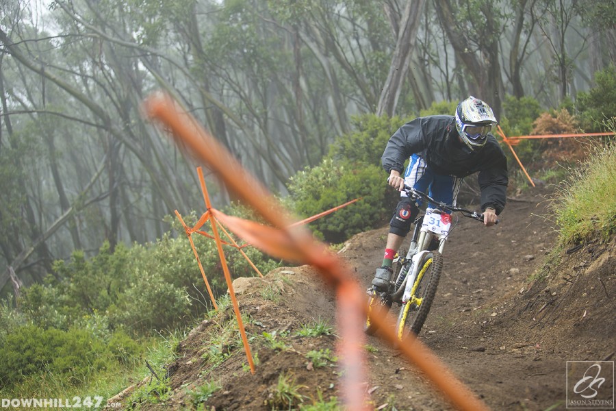 Elijah Marinov pushes out of one of the first berms in the open section, already eyeing off the following one.