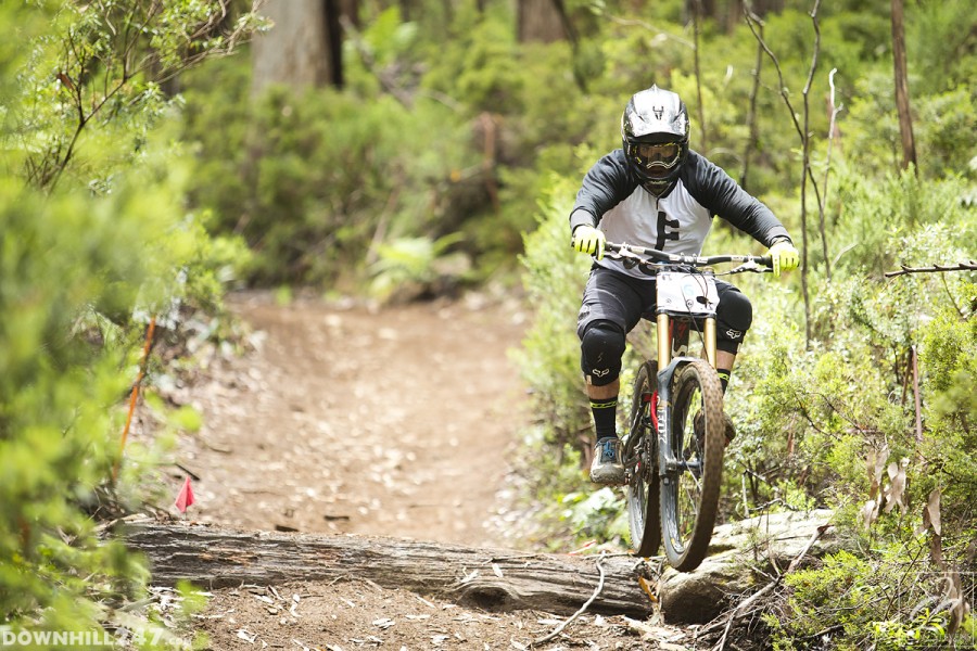 Jesse Beare rockets through the small jumps and drop before entering the fire road.