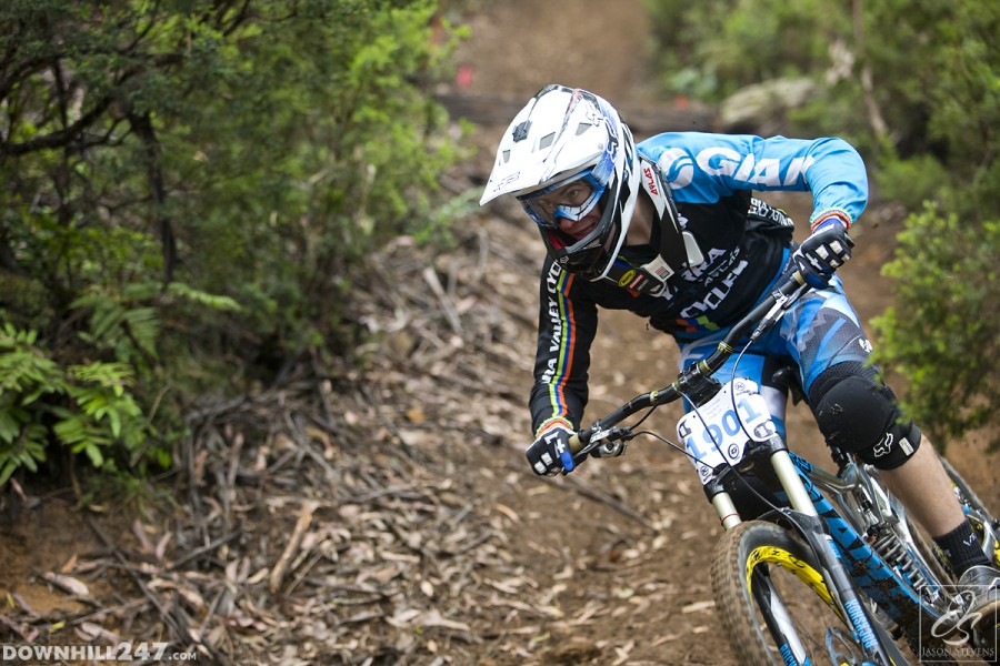 Aiden Varley pushes hard into the final berm before the fire road, holding as much speed as possible.