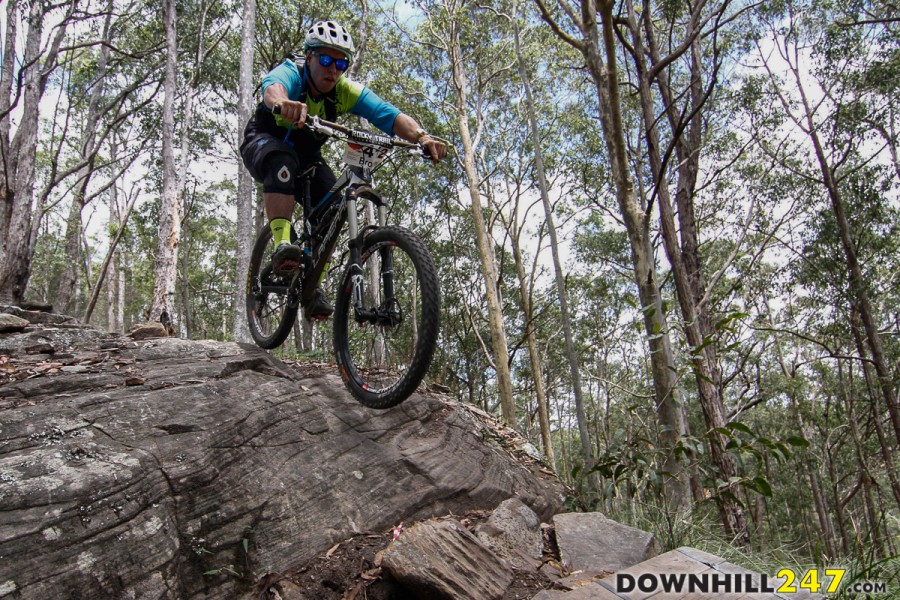 Bromley Richards tackles the most mentally-tough section of the day, a rock roller come wooden tranny which sends riders hurtling into a pedal section before dropping into the second half of the track.