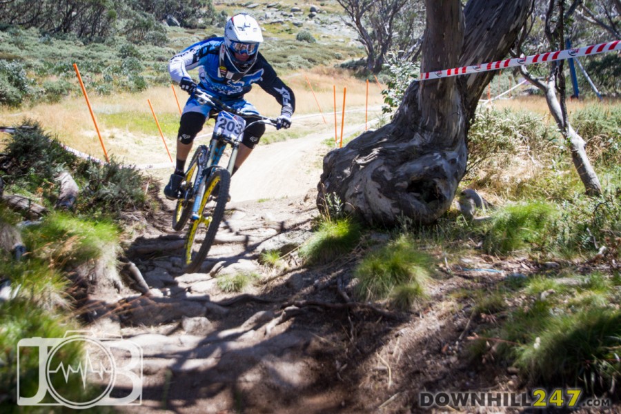 Aiden Varley tackles an early root and rock section with ease, floating through with barely a whirr of tyres for 4th place for Yarra Valley Cycles.