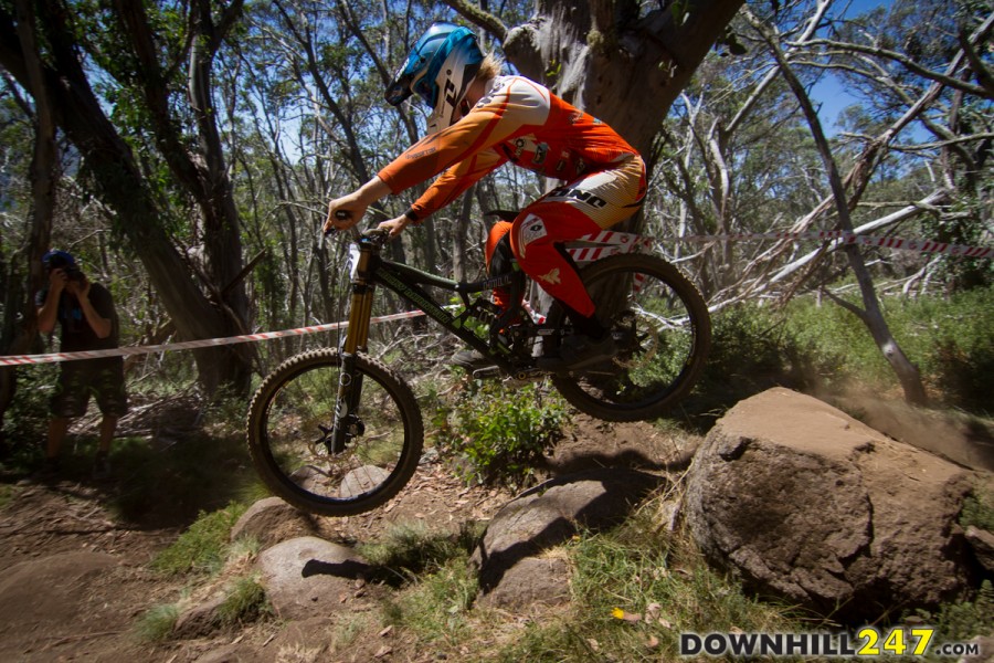 Ben Hill swoops through, passing the rock hit and taking an inside line, hovering above the rocks and keeping good pace through the rough top section.