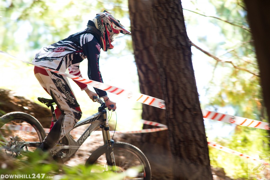 Ben Kelaart cruises down, satisfied with surviving the steep root section.