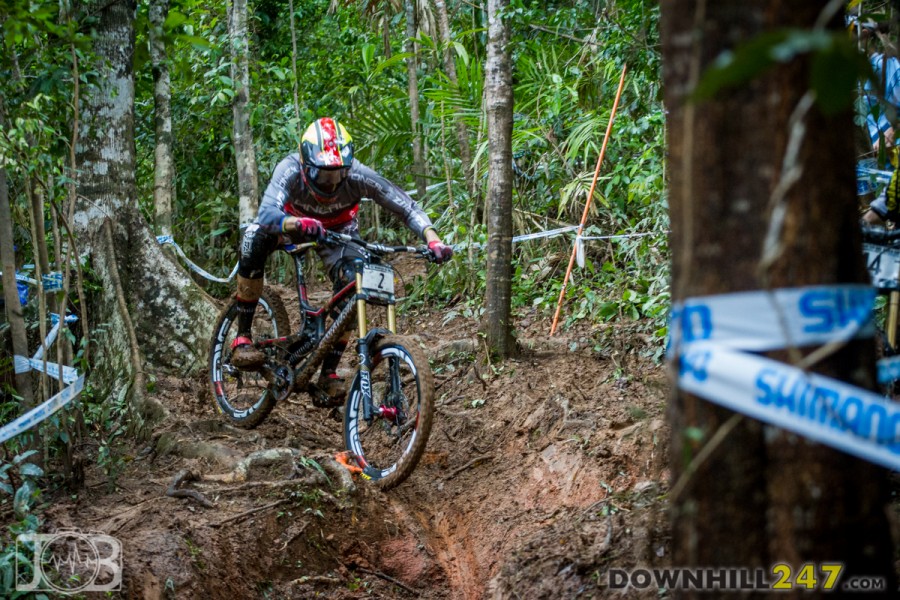 Greg Minnaar gets sideways, holding a technical line through the roots and mud. We'd like to tell you he rode out of this one, but instead he layed down and held the bike off the mud!