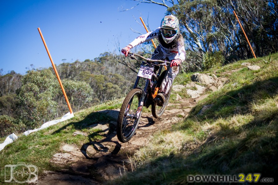 Harry Parsons hovers above the rocks, carrying serious pace. Much of the alpine trail was holding it's ground against the barrage of riders and soggy conditions.