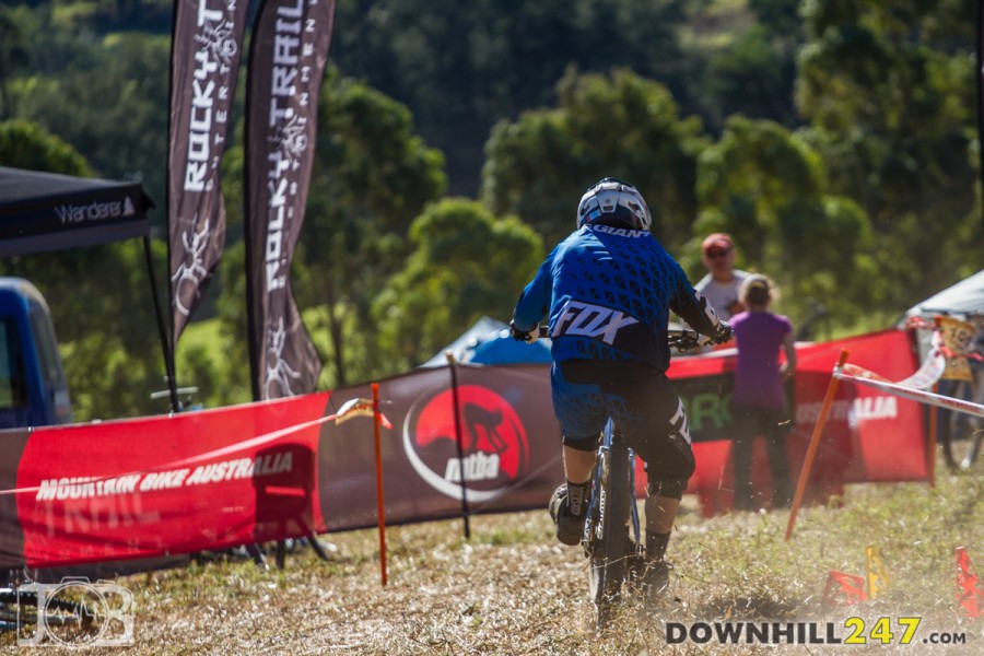 Tim Eaton throws a finish line wheelie during qualies; making a statement for the final with a time of 2:08.