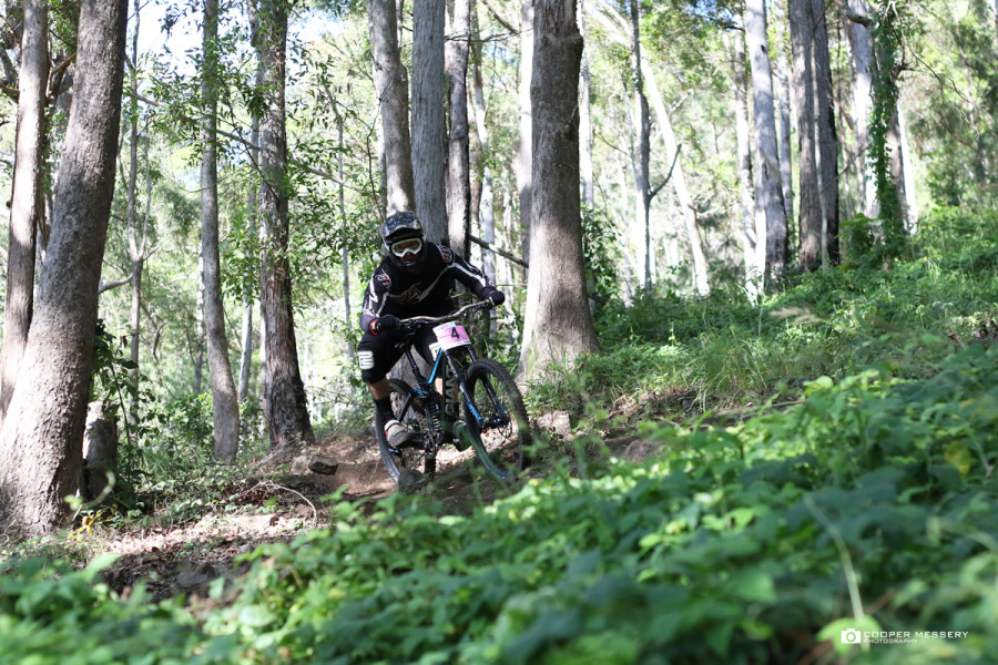 Recent rain has left a lot of vegetation around the track and transformed the normally dusty track into a grippy, tacky trail that the riders were railing hard throughout practice before it got chopped up a bit prior race runs.