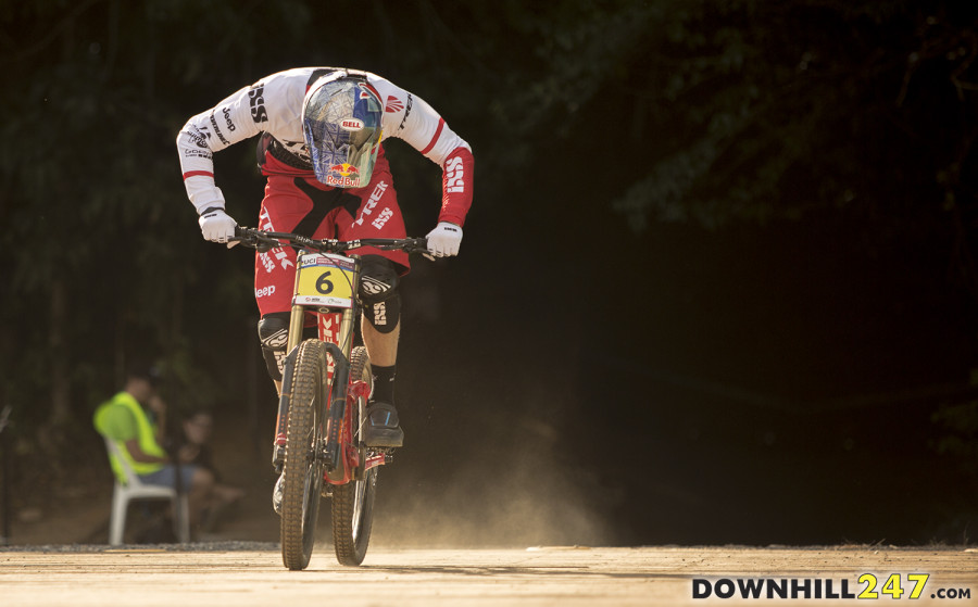 Gee Atherton sprinting for the line, head down showing the physical effort required in the end.